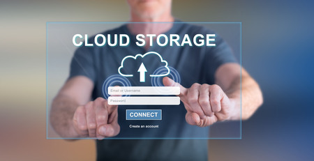 Man touching a cloud storage concept on a touch screen with his fingersの写真素材