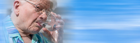 Portrait of senior woman drinking waterの写真素材