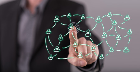 Man touching a social network concept on a touch screen with his fingerの写真素材