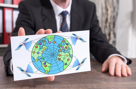 Businessman showing an index card with global web network concept