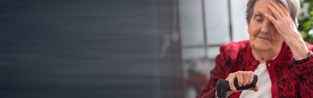 Old woman with a headacheの写真素材