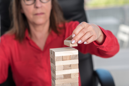Business development concept by building a tower with domino blocksの写真素材