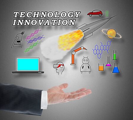 Technology innovation concept levitating above a hand on grey backgroundの写真素材
