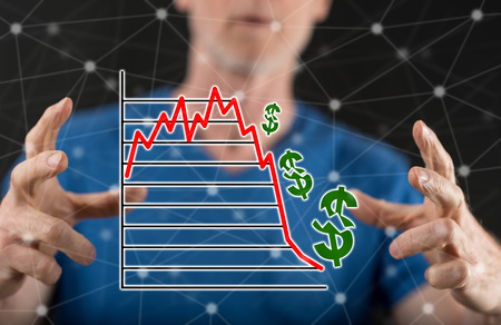 Stock market crash concept between hands of a man in background