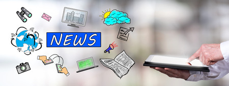 Man using a tablet with news conceptの写真素材