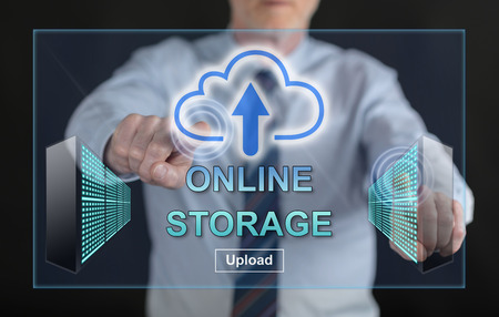Man touching an online storage concept on a touch screen with his fingersの写真素材