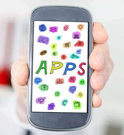 Hand holding a smartphone with apps concept
