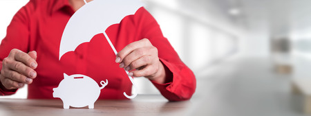 Businesswoman protecting his savings, concept of saving protectionの写真素材