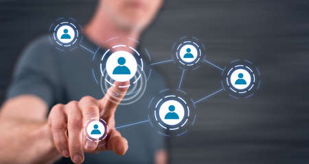 Man touching a social media network on a touch screen with his fingerの写真素材