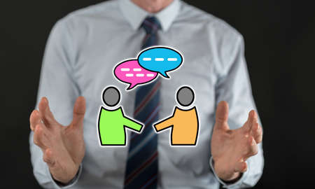 Dialog concept between hands of a man in background