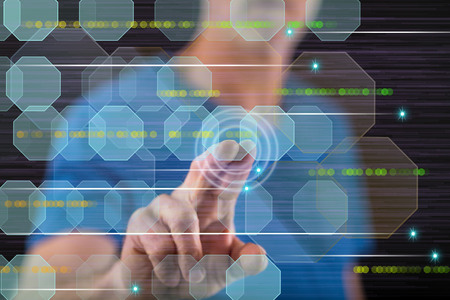 Man touching an abstract technology concept on a touch screen with his finger