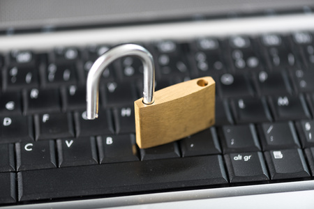 Computer security concept with a padlock on a keyboard