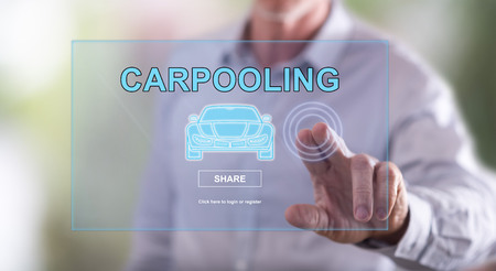Man touching a carpooling concept on a touch screen with his fingerの写真素材