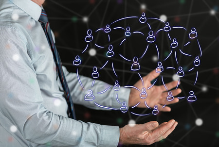 Social network concept above the hands of a man