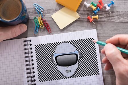 Virtual reality concept drawn on a notepad placed on a desk