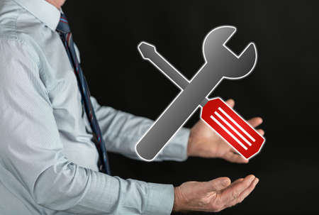 Maintenance service concept above the hands of a manの写真素材