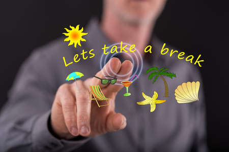 Man touching vacation time on a touch screen with his fingerの写真素材