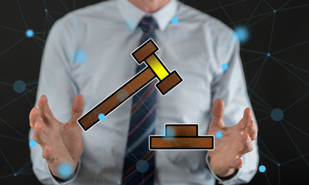 Judgment concept between hands of a man in backgroundの写真素材