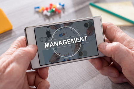 Management concept on mobile phoneの写真素材