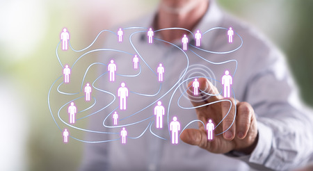 Man touching a social network concept on a touch screen with his fingerの写真素材