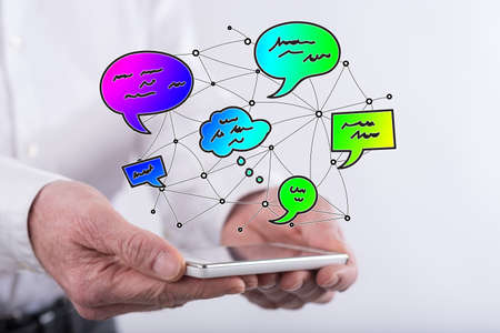 Communication network concept above a smartphone held by hands