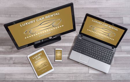 Luxury car rental concept shown on different information technology devicesの写真素材