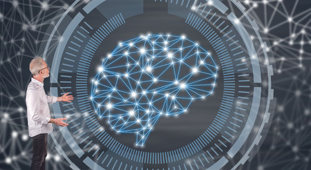 Businessman showing an intelligence concept on a wall screenの写真素材