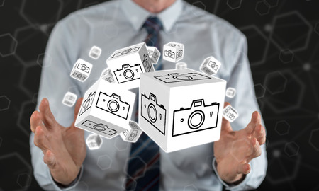 Pictures sharing concept between hands of a man in background