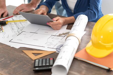 Architects working on plans at office