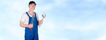 Portrait of senior mechanic on blurred background