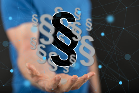 Law concept above the hand of a man in background