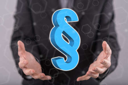 Law concept above the hands of a man in background