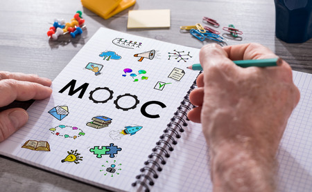 Hand drawing mooc concept on a notepadの写真素材