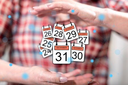 31 december concept between hands of a woman in backgroundの写真素材