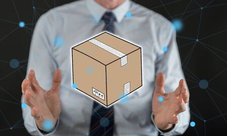 Packaging concept between hands of a man in background
