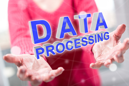 Data processing concept above the hands of a woman in backgroundの写真素材
