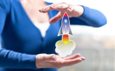Startup concept between hands of a woman in backgroundの写真素材