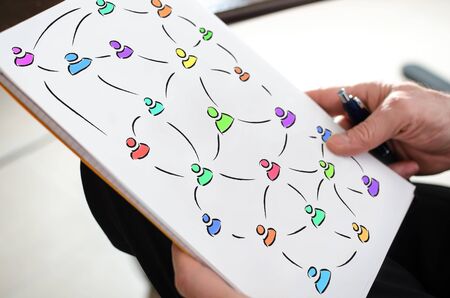 Social network concept on a paper held by a hand