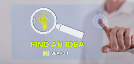 Man touching an idea search concept on a touch screen with his fingerの写真素材
