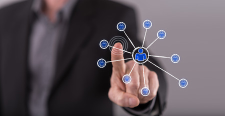 Man touching a social network concept on a touch screen with his fingerの写真素材