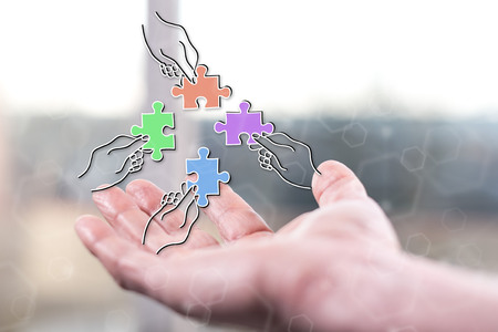 Teamwork concept above a hand of a man