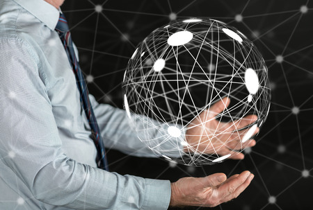 Global connection concept above the hands of a manの写真素材