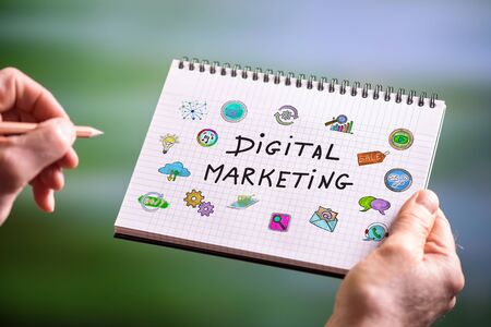 Hand drawing digital marketing concept on a notepadの写真素材