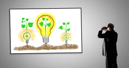 Man looking at ideas concept through binocularsの写真素材