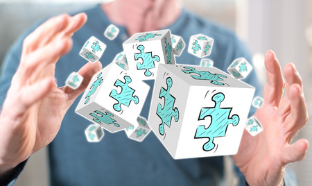 Business partnership concept between hands of a man in background