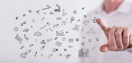 Man touching business doodles on a touch screen with his fingerの写真素材