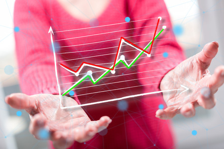 Business analysis concept above the hands of a woman in backgroundの写真素材