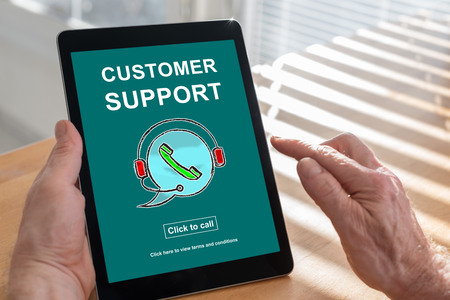 Tablet screen displaying a customer support conceptの写真素材