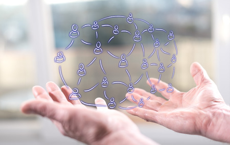 Social network concept above the hands of a man