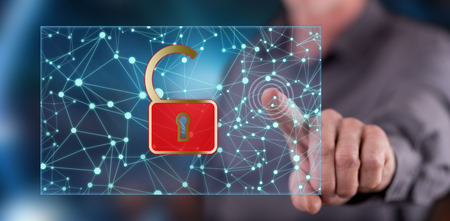 Man touching a network security concept on a touch screen with his fingerの写真素材
